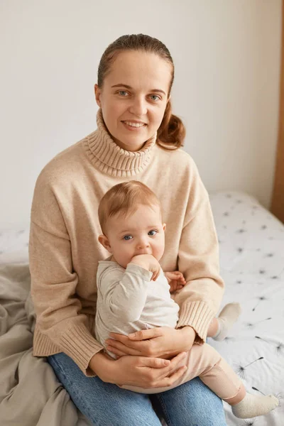 Portrait Smiling Positive Woman Ponytail Wearing Beige Sweater Infant Baby — Stock Photo, Image