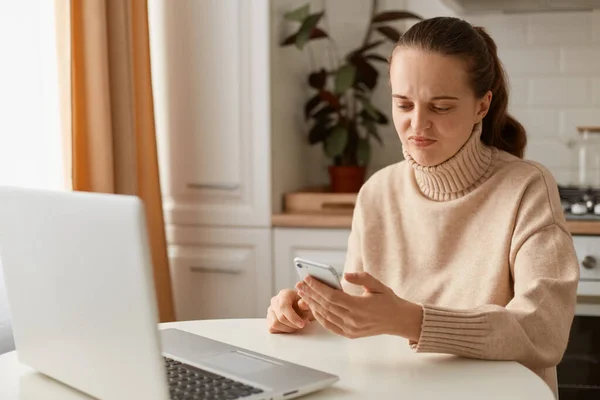 Portrait Sad Disappointed Young Woman Wearing Beige Sweater Sitting Kitchen — Stock Photo, Image