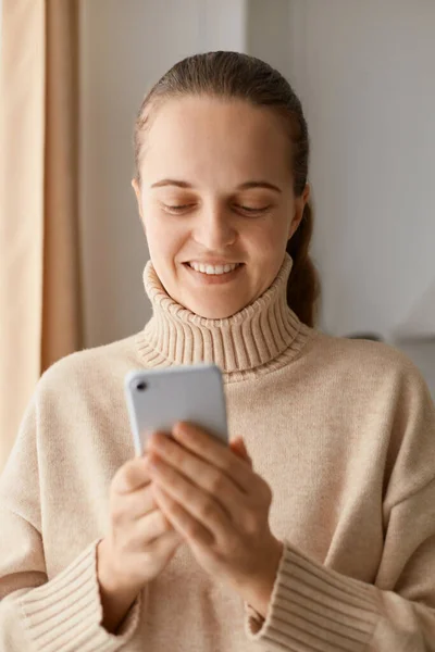 Portrait Smiling Delighted Young Adult Woman Wearing Beige Jumper Holding — Stock Photo, Image
