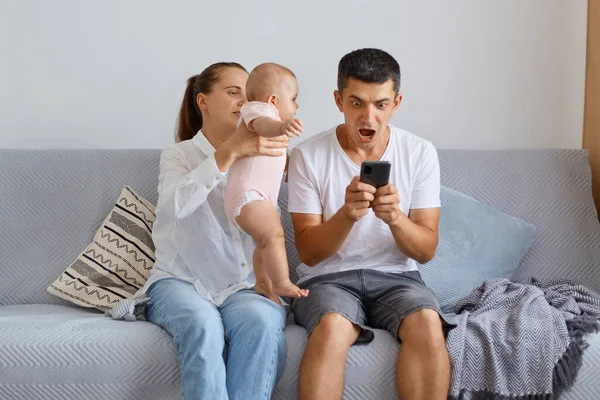 Portrait Woman Baby Hands Trying Pay Husband Attention Man Playing — Stock Photo, Image