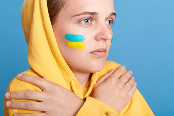 Closeup Portrait Scared Sad Depressed Woman Hoodie Ukrainian Flag Cheeks — стокове фото