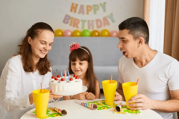 Indoor Shot Little Girl Blowing Out Candles Her Birthday Her — Fotografia de Stock