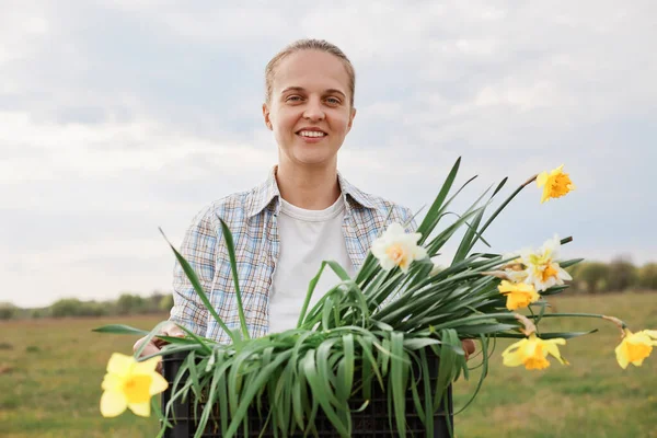 Outdoor Shot Young Adult Smiling Positive Female Farmer Holding Box — Stok Foto