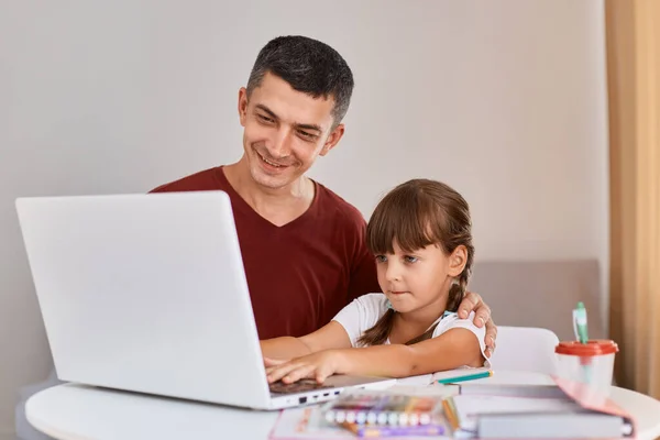 Indoor Shot Father Wearing Maroon Shirt Doing Homework Daughter Having —  Fotos de Stock