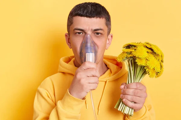 Unhealthy Man Wearing Casual Style Hoodie Posing Isolated Yellow Background — Φωτογραφία Αρχείου