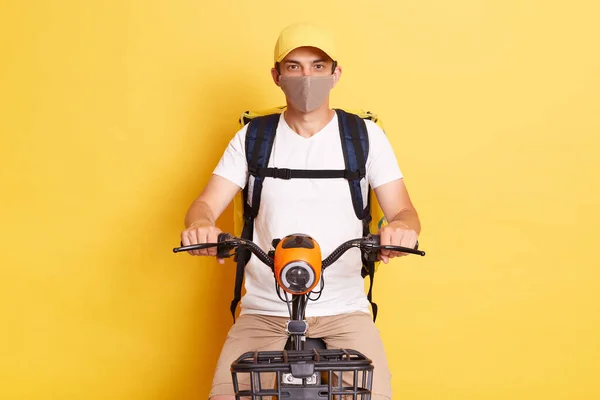 Indoor Shot Man Courier Riding Cycle Wearing White Shirt Cap — Stock fotografie