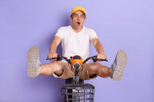 Full Length Funny Caucasian Delivery Man Yellow Cap Riding Bicycle — Stock fotografie