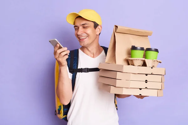 Portrait Happy Caucasian Delivery Man Food Drinks Standing Isolated Purple — Stockfoto