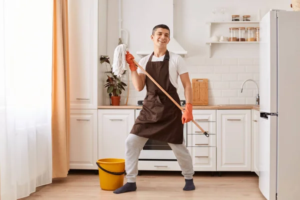 Portrait Young Man Washing Floor Kitchen Listening Music Dancing Holding — Stok Foto