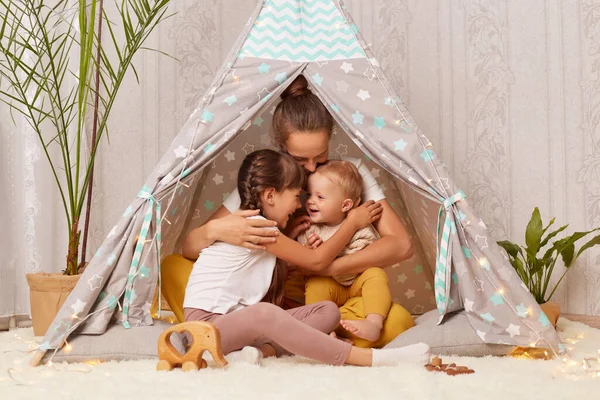 Young Happy Family Teepee Tent Loving Mother Two Kids Sitting — Stock Photo, Image