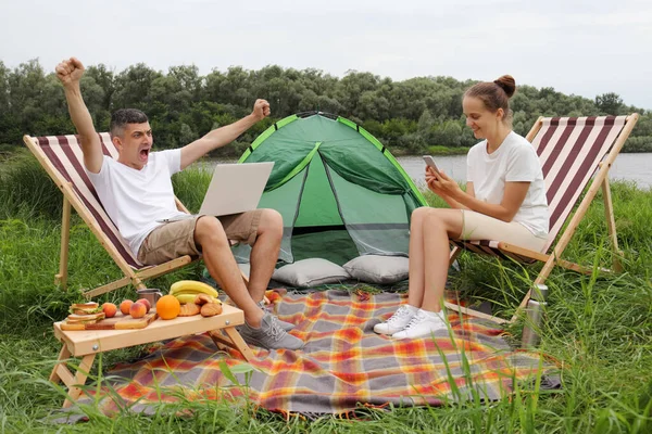 Portrait Young Caucasian Man Laptop Tent Sitting Folding Arm Chair — 图库照片