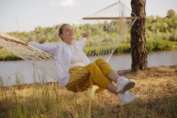 Image Happy Positive Optimistic Woman Sitting Hammock Water Laughing Happily — Stockfoto