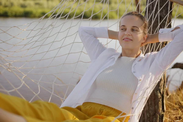 Outdoor Shot Relaxed Satisfied Caucasian Woman Wearing White Shirt Sitting — Zdjęcie stockowe