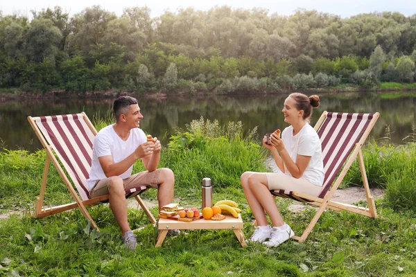 Portrait Satisfied Family Sitting Deck Chair Drinking Coffee Croissant River — Foto de Stock