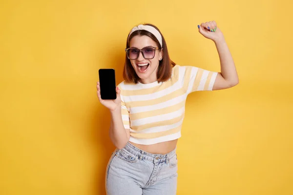 Portrait Happy Woman Wearing Striped Shirt Jeans Posing Isolated Yellow — Stok Foto