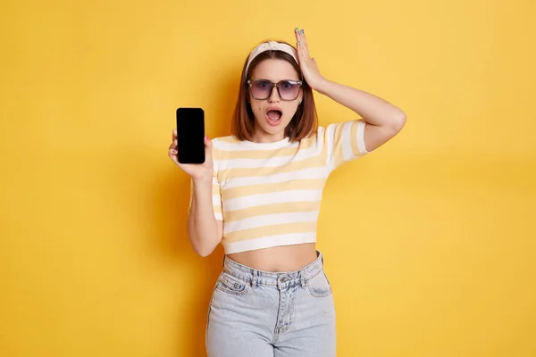 Shocked Woman Wearing Striped Shirt Jeans Posing Isolated Yellow Background — Stok Foto