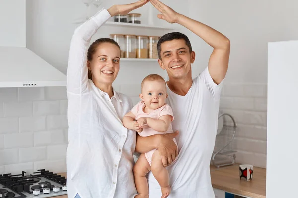 Indoor Shot Happy Smiling Couple Standing Baby Daughter Making Roof — Stock Photo, Image