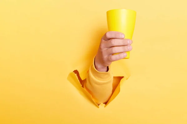 Indoor Shot Person Hand Breaking Yellow Paper Holding Cup Water — Foto de Stock