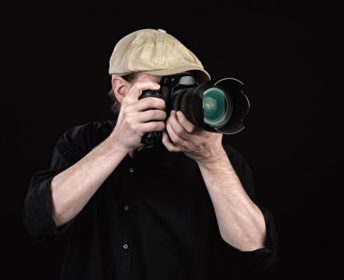 A photographer with a nice camera. clipart