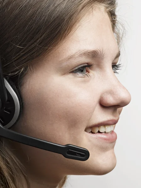 Portrait of a confident young female customer service agent with — Stock Photo, Image