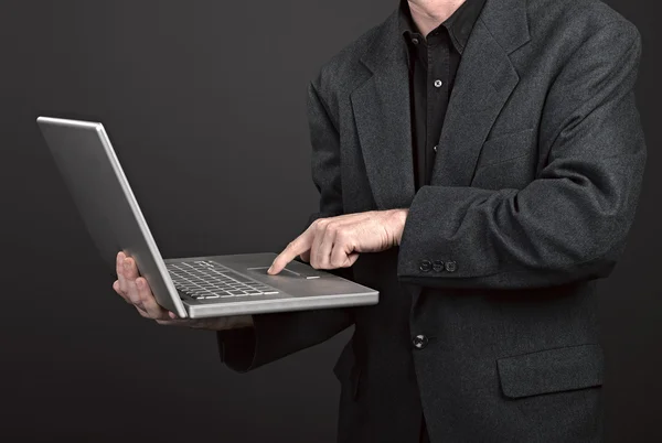 Businessman holding his laptop — Stock Photo, Image