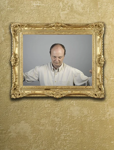 Portrait in gold frame on wall — Stock Photo, Image