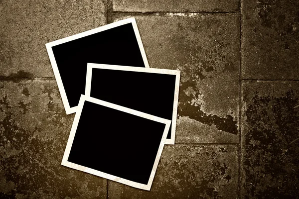 Blank photo frames on grunge background — Stock Photo, Image