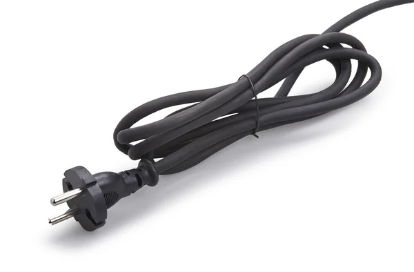 Černá napájecí kabel se zástrčkou izolovaných na bílém — Stock fotografie