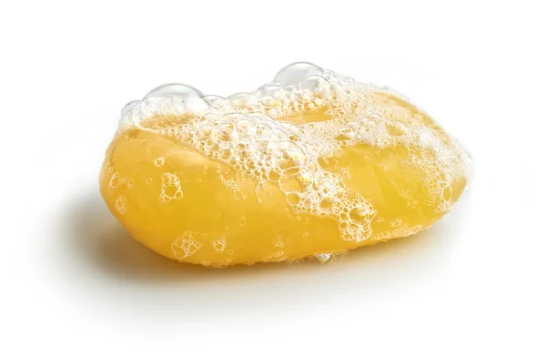 Burbuja de jabón amarillo de aislamiento sobre un fondo blanco Imagen de stock