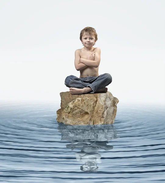 Zen Kid on rock in water — Stock Photo, Image