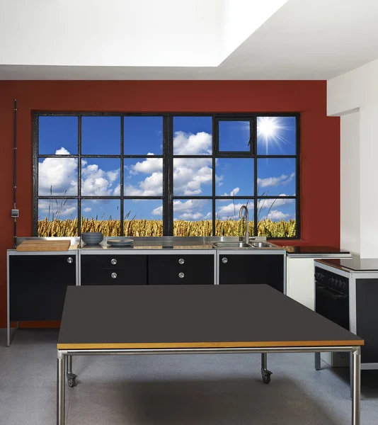 Loft kitchen and windows frames with wheat field in background — Stock Photo, Image