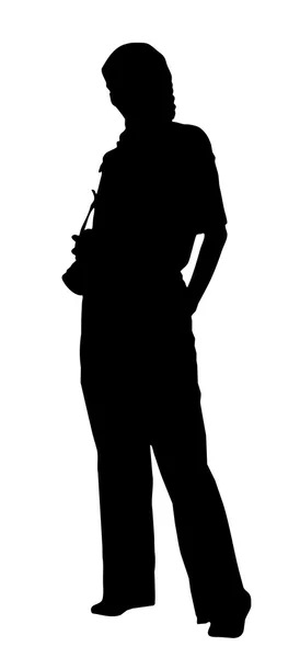 Portrait silhouette of a young woman photographer holding a came — Stock Fotó