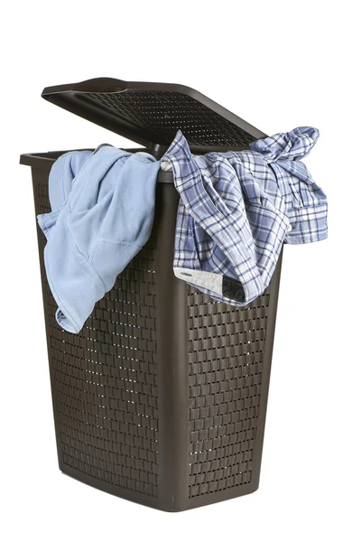 Bright clothes in a laundry open basket on white background — Stock Photo, Image