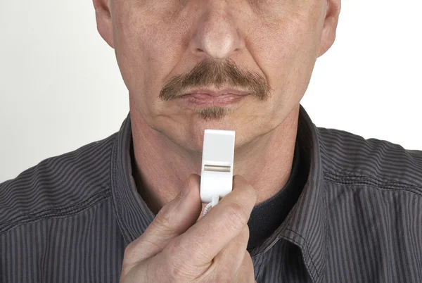Men with whistle. Referee with whistle on grey background — Stock Photo, Image