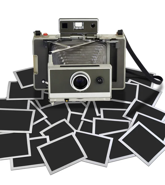Vintage instant camera with some frame — Stock Photo, Image