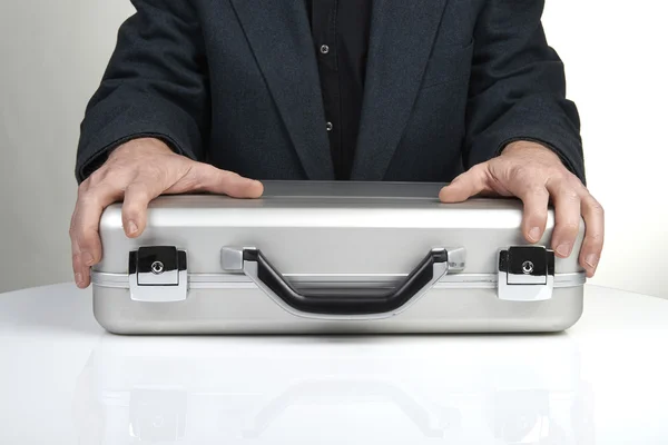 Business person holding a briefcase — Stock Photo, Image