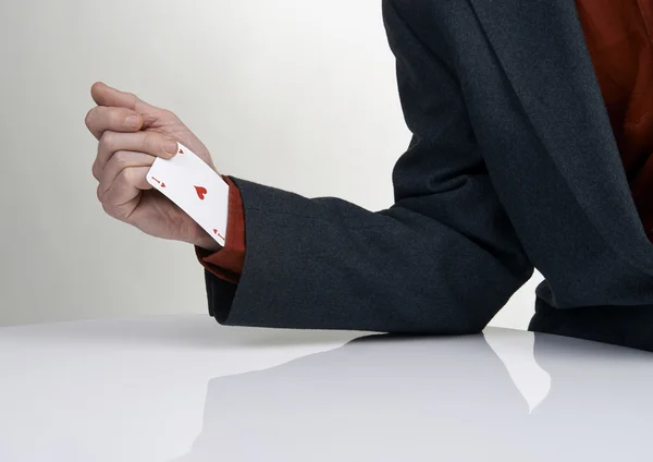 Casino gamer drawing card from his sleeve — Stock Photo, Image