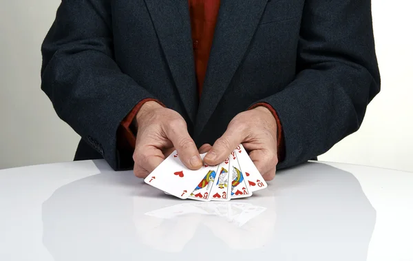 Una escalera real jugando cartas mano de póquer en los corazones — Foto de Stock