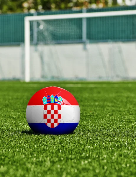 Fotboll med Kroatien flagga på gräset i stadium — Stockfoto