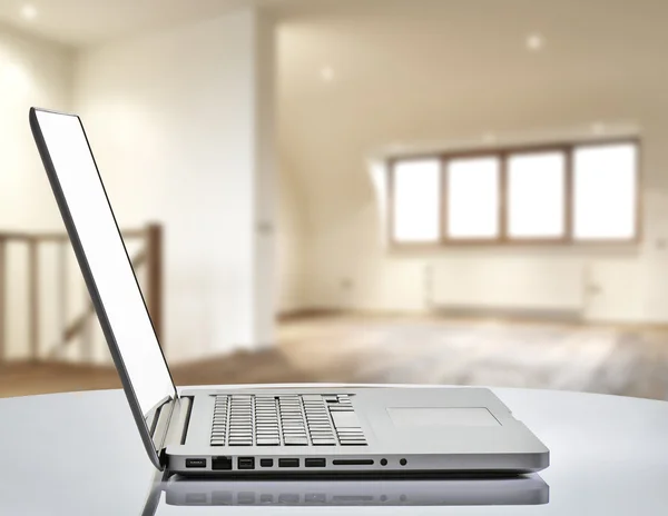 Laptop with man hand in loft studio — Stock Photo, Image