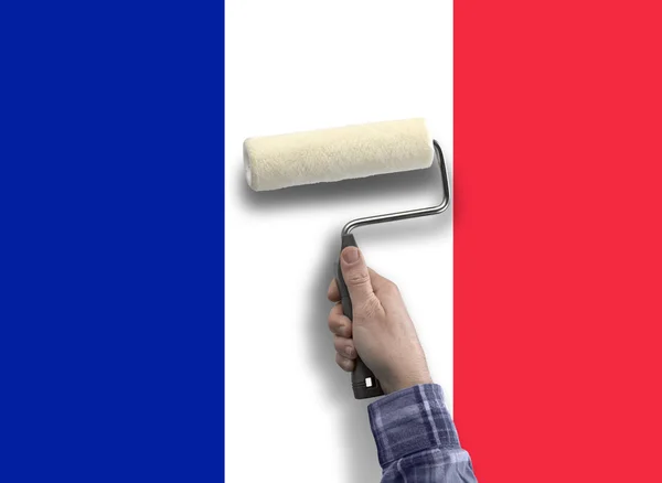 Mano humana con la pintura de la bandera de Francia — Foto de Stock