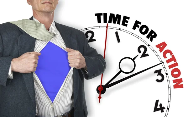 Businessman showing superhero suit against clock — Stock Photo, Image