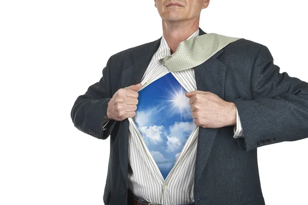 Businessman showing superhero suit underneath his shirt standing — Stock Photo, Image