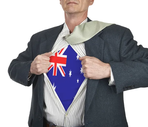 彼の下にあるオーストラリアの旗スーパー ヒーローのスーツを示す実業家 — ストック写真