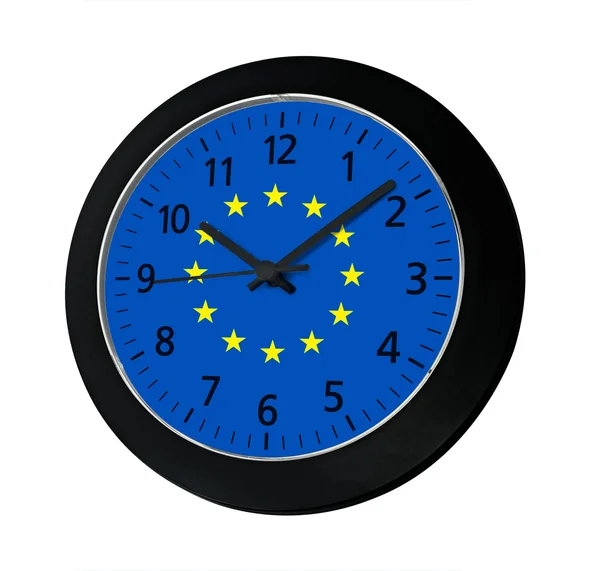 Schwarze Uhr mit Europafahne an der Wand — Stockfoto
