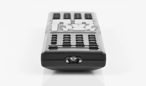 Télécommande clavier noir en gros plan sur blanc isoléπληκτρολόγιο απομακρυσμένου ελέγχου μαύρο σε closeup σε λευκό απομονωθεί — Φωτογραφία Αρχείου