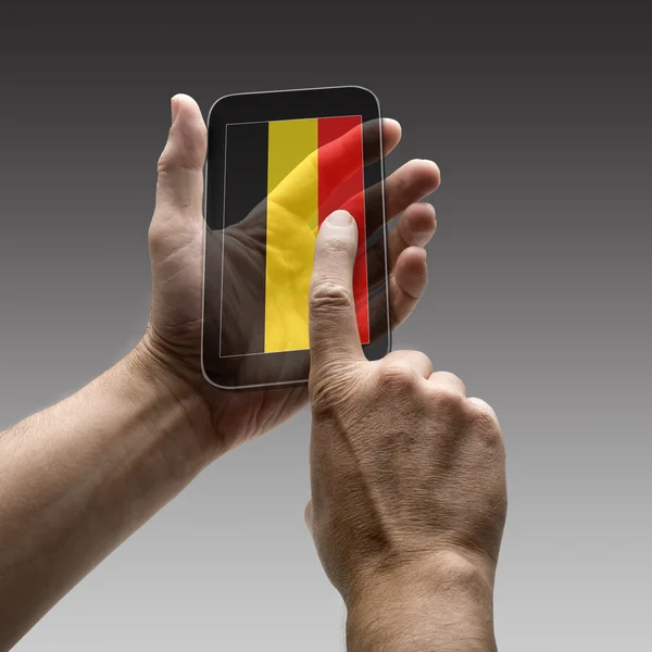 Holding Belgium flag screen smart phone — Stock Photo, Image