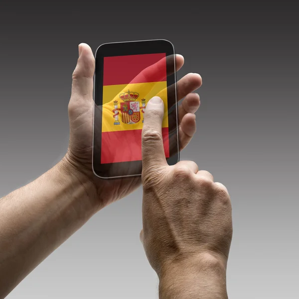 Mantener la bandera de España pantalla de teléfono inteligente —  Fotos de Stock