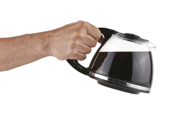 Kaffeekanne von der menschlichen Hand gehalten — Stockfoto