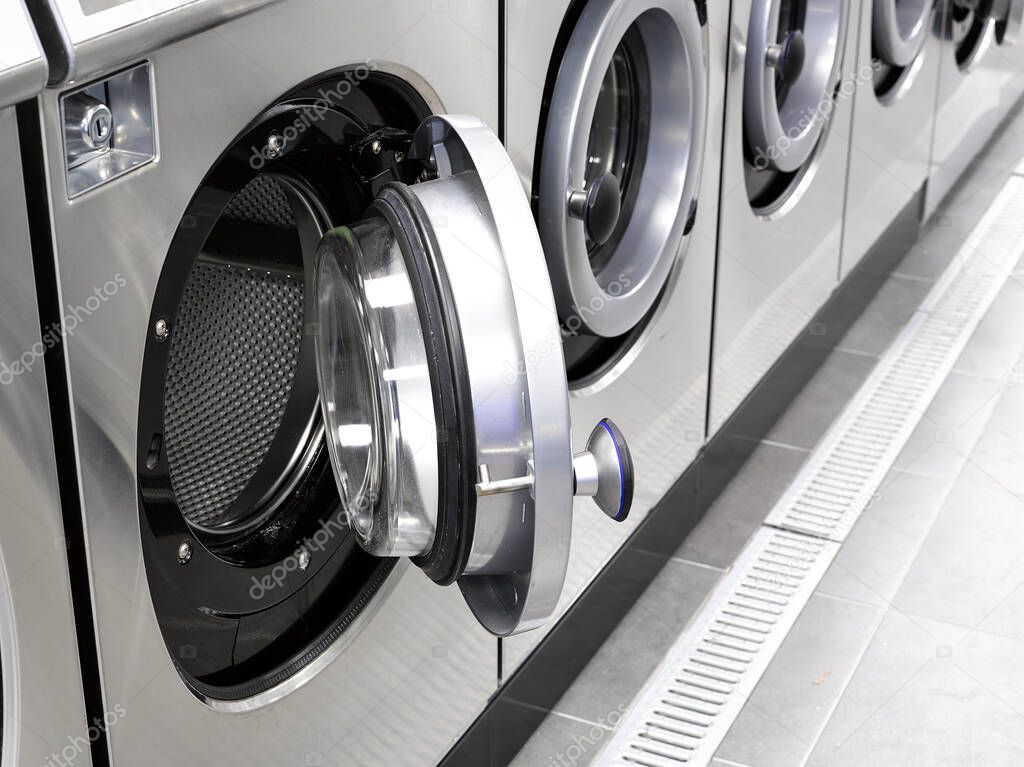 Industrial washing machines in a public laundromat